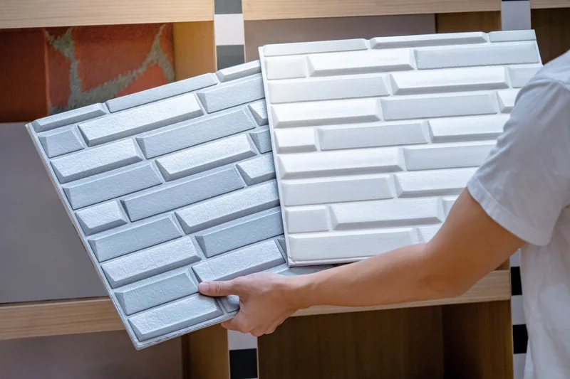 Designer reviewing full-size wall panel samples